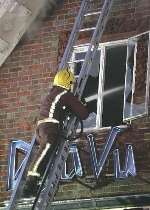 A firefighter helps bring the blaze under control