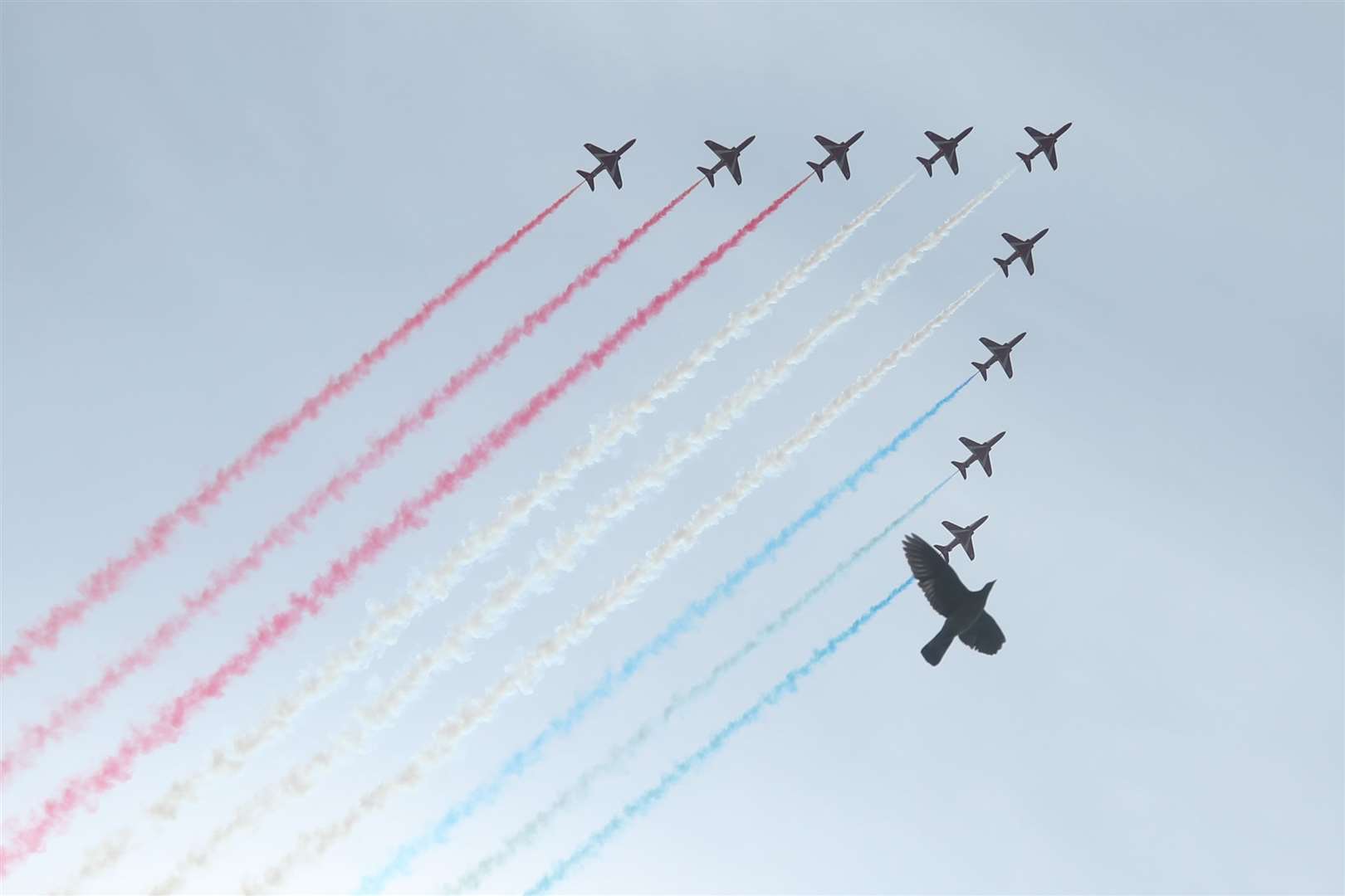 The Royal Air Force Red Arrows pass over the Horseguards Parade during a flypast in central London to mark the 75th anniversary of VE Day (Yui Mok/PA)