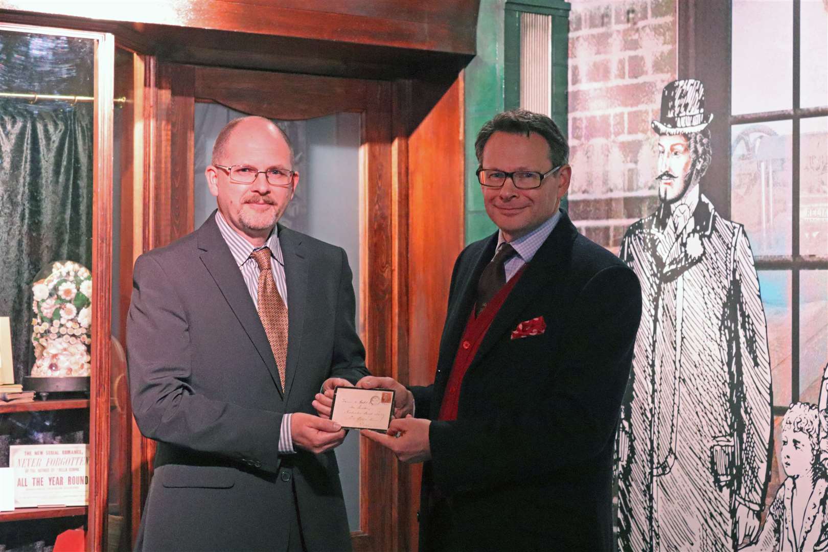 Charles Dickens' great, great grandson Harry Whinney, right, delivering the letter to The Guildhall Museum. Picture: Medway Council