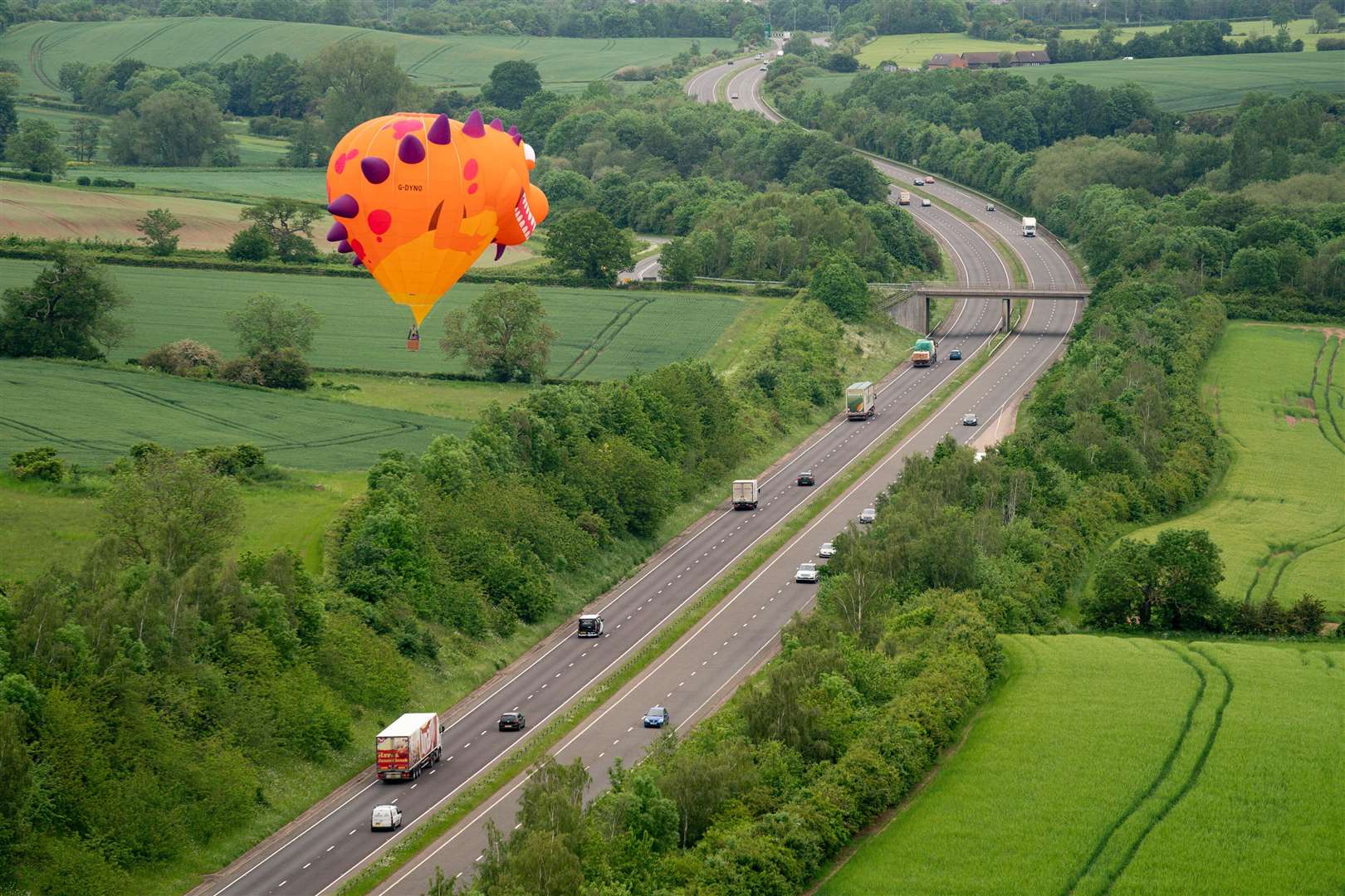 The dragon chased the motorway traffic (Jacob King/PA)