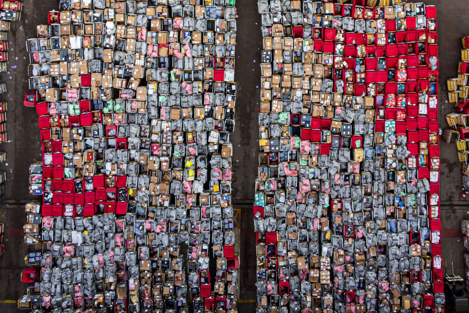 Cages of items awaiting delivery at a Royal Mail base in Bristol amid strike action (PA)