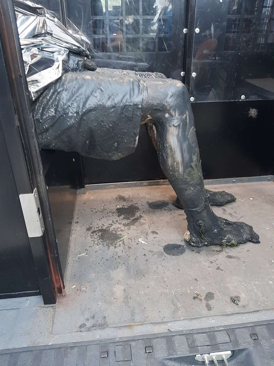 The suspect covered in mud following the police chase through the mudflats of Langstone Harbour next to Portsmouth (Hampshire Constabulary/PA)