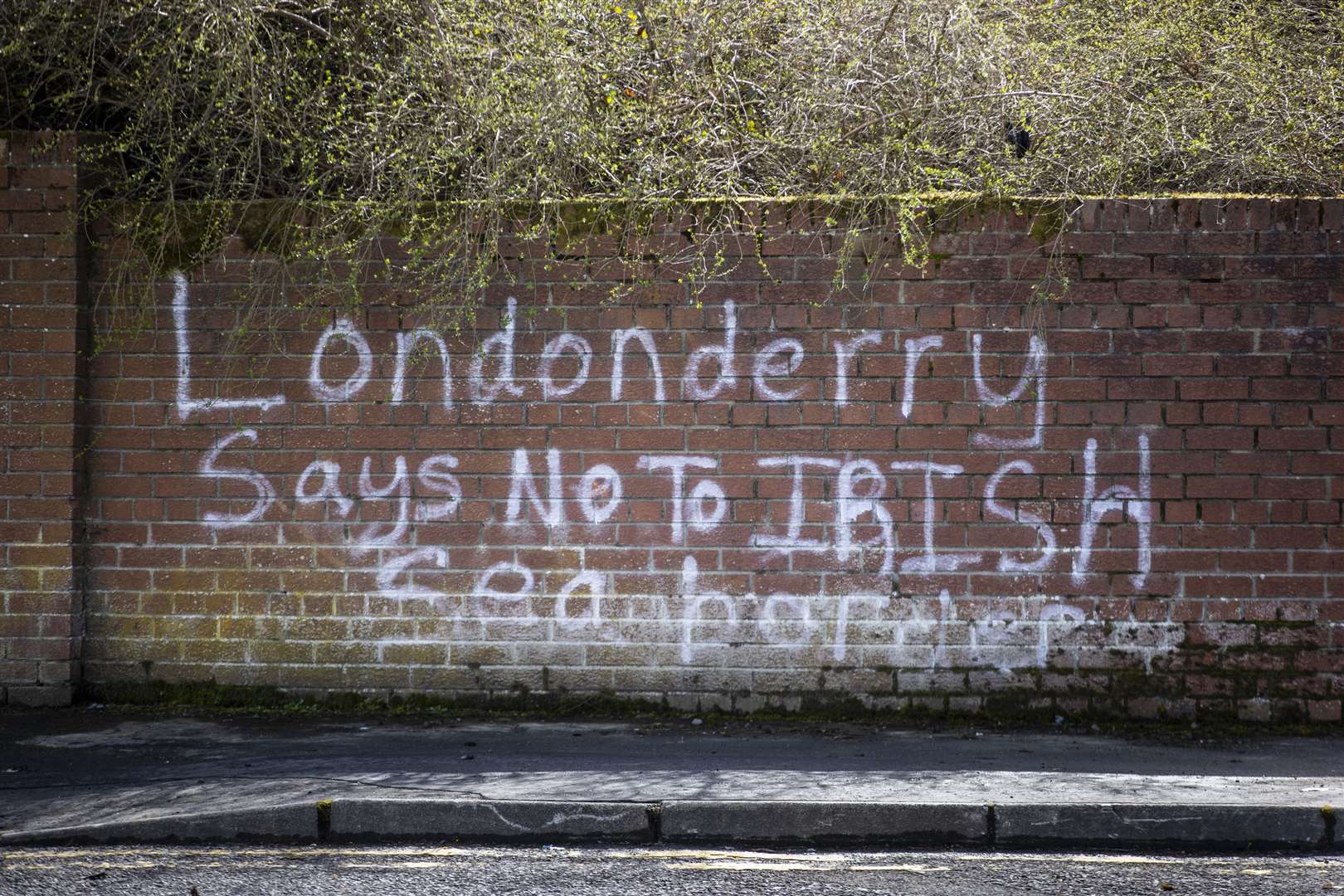 Graffiti on a wall in the Waterside of Derry City (Liam McBurney/PA)