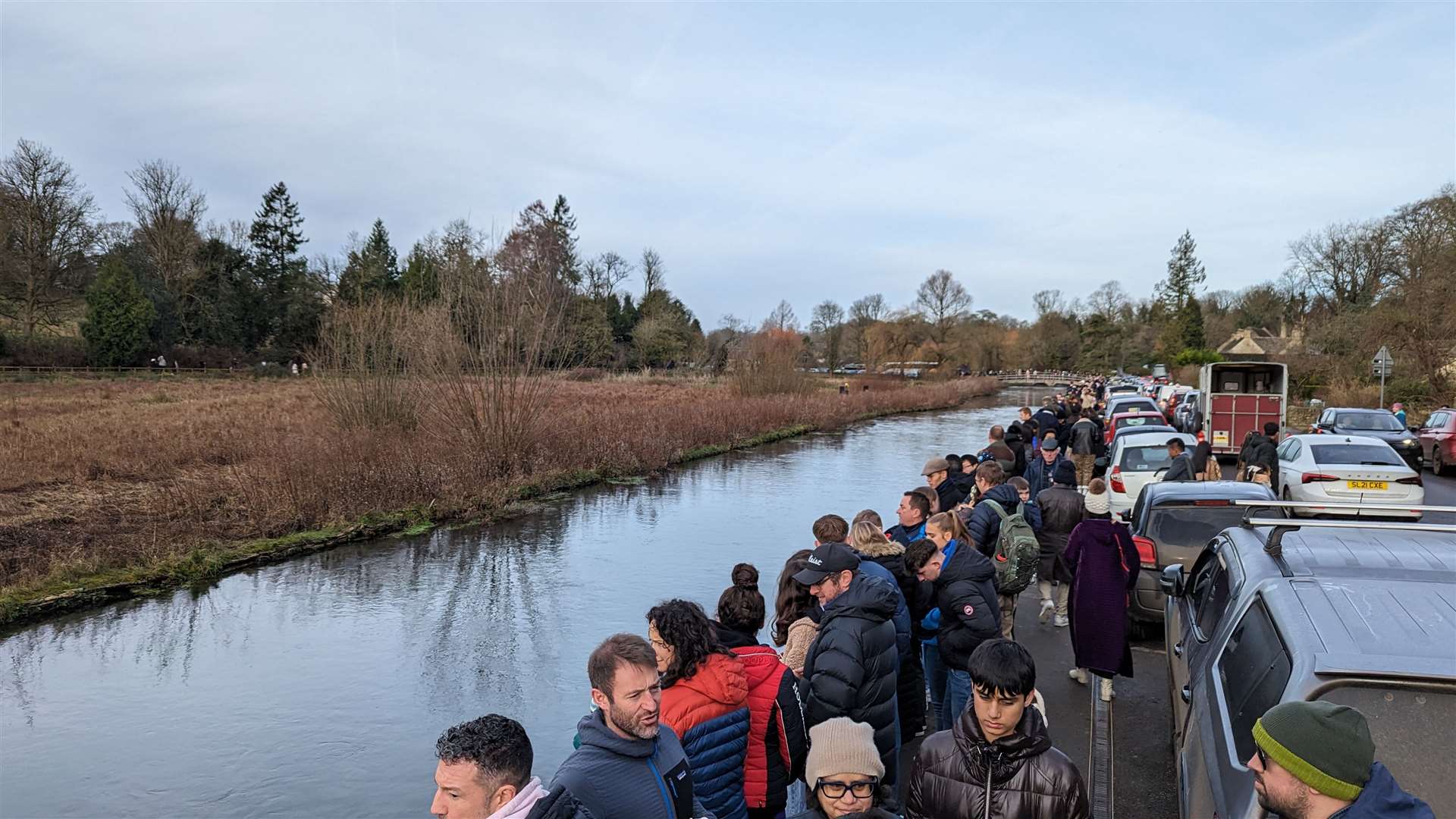 People flocked to the River Coln to see the duck race (Bibury Cricket Club/PA)