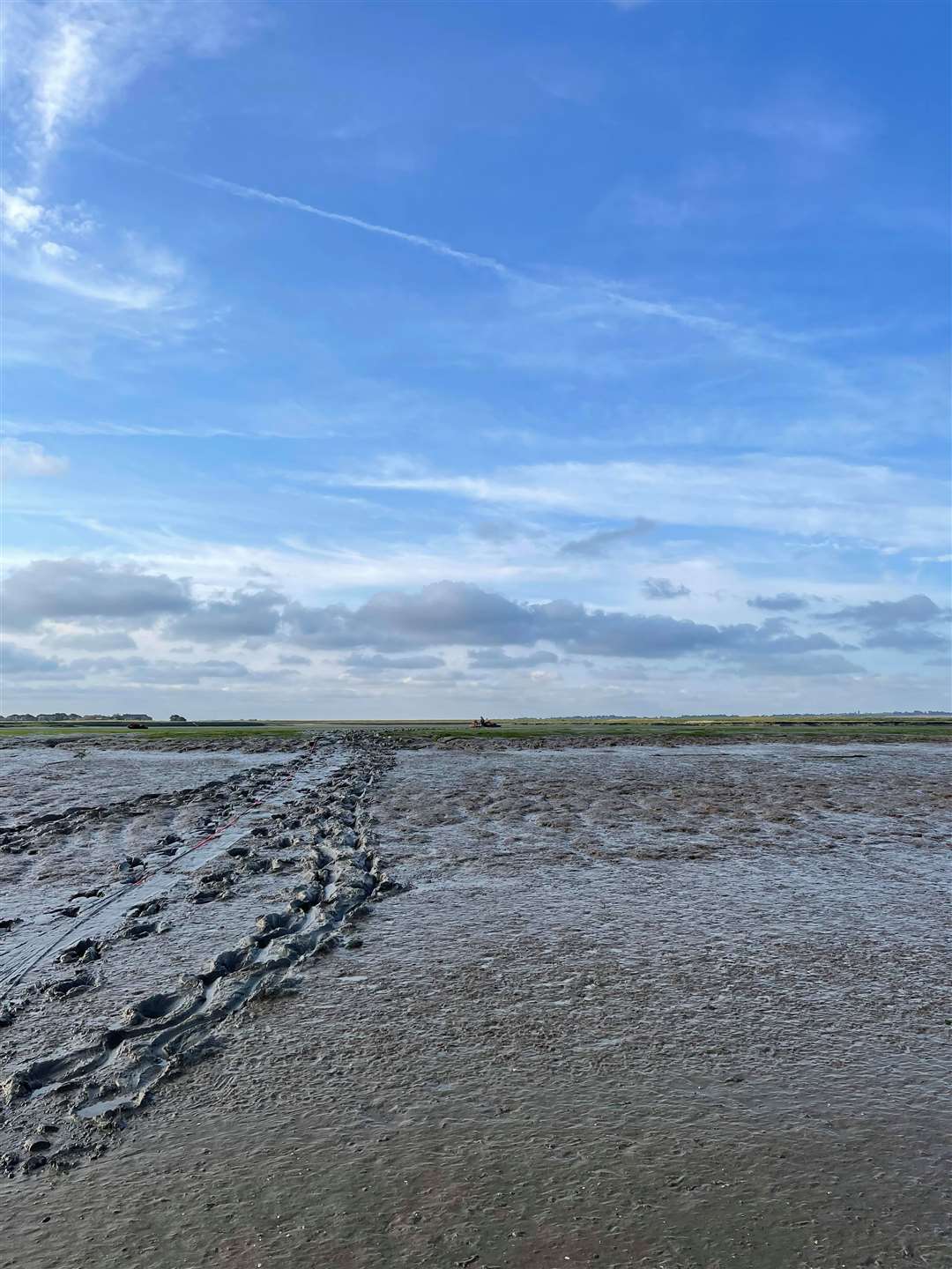 The jet skis were so far away on the mud flat it was difficult to spot them