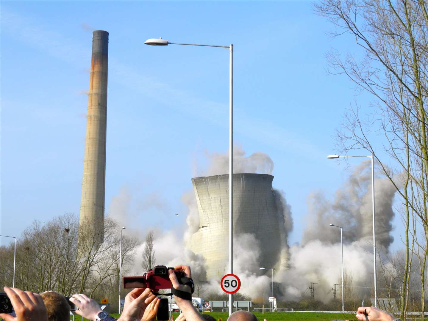 People hold their cameras up to capture the key moment. Picture: Colin Varrall