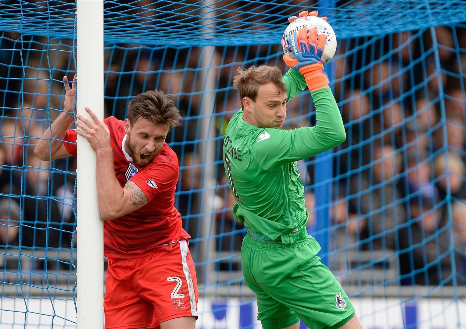 Gillingham's Luke O'Neil fails to get to the ball first Picture: Ady Kerry