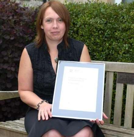 BRAVE MOTHER: Amanda Barnes with her framed certificate