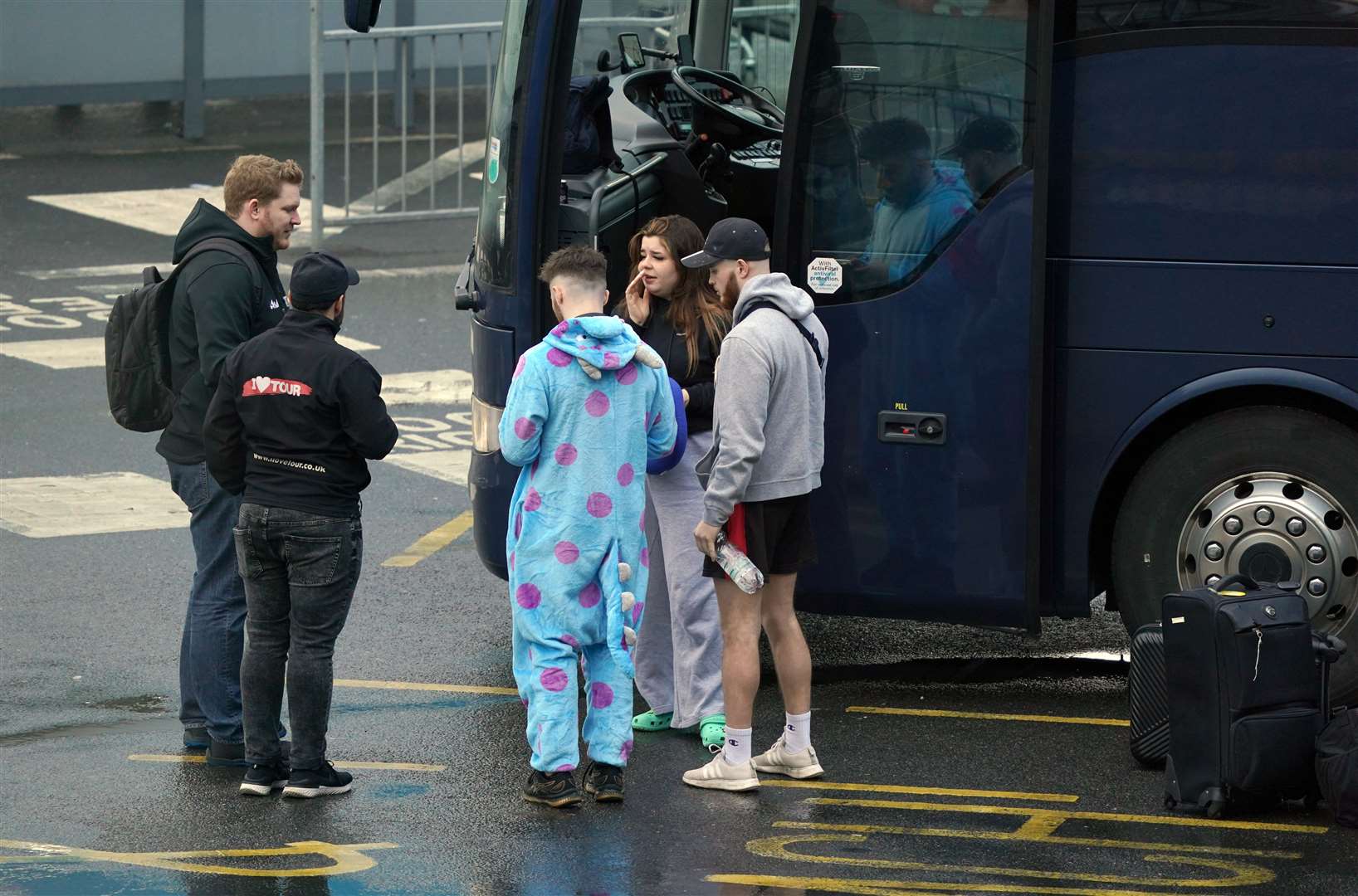 Passengers by their coach in Dover (Gareth Fuller/PA)